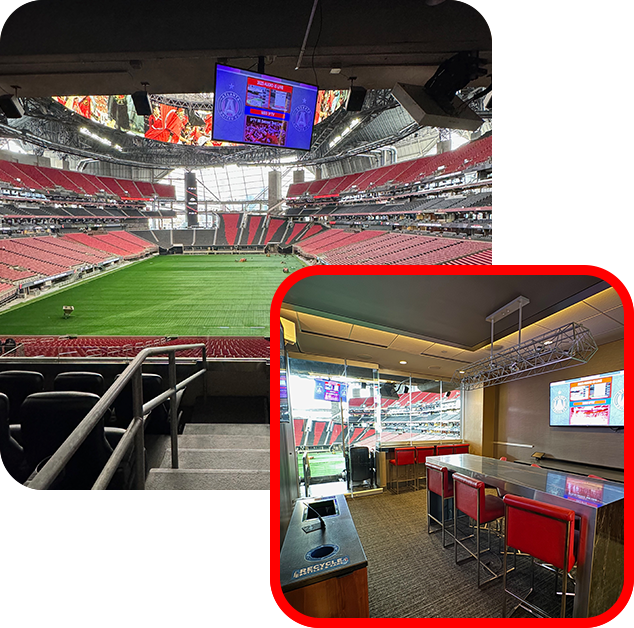A stadium with a large screen and a bar.
